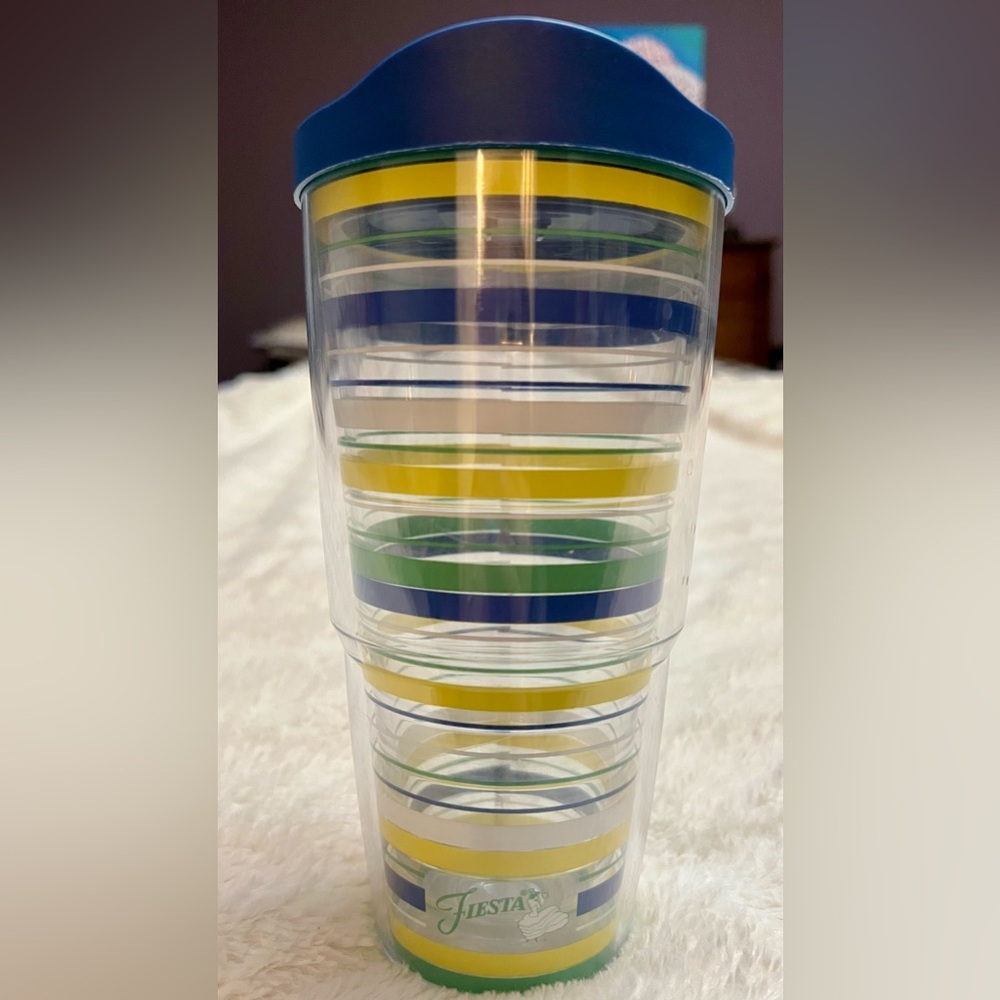Tervis Fiesta Meadow Striped Tumbler with Blue Lid in very good used condition.